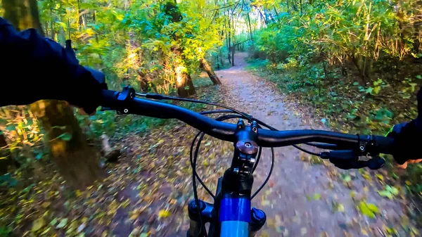 Amateur rider riding on the trails in the autumn season