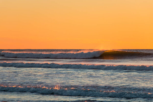 Sunset waves breaking at Ocean Beach, San Francisco, California 