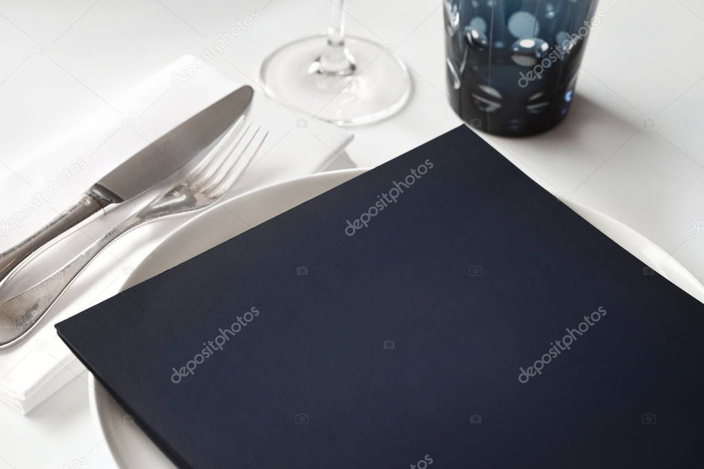 Menu card on a table set in a luxurious restaurant