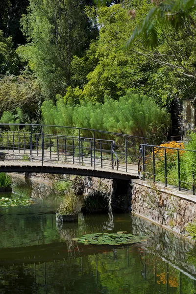 Wooden deck and small canal in a park