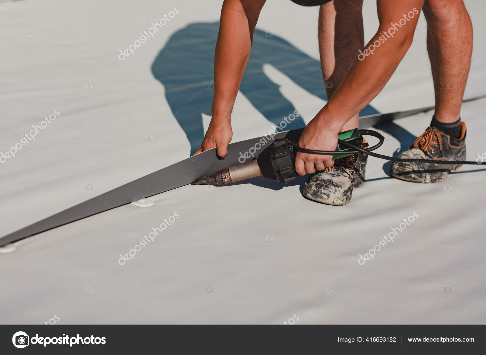 Worker Welding Pvc Roof Membrane Heater Welder Machine Stock Photo by