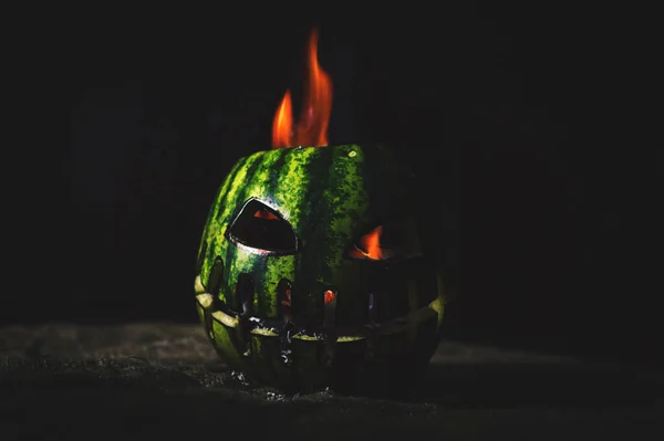 Halloween apocalypse green watermelon in ash and heat