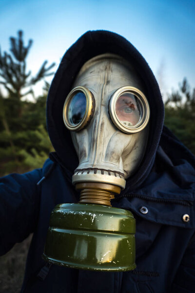 no people in a protective mask against coronavirus in a sunny forest gas mask best protection
