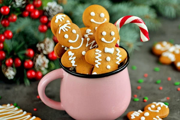 Christmas gingerbread cookie man in a mug decorated with icing
