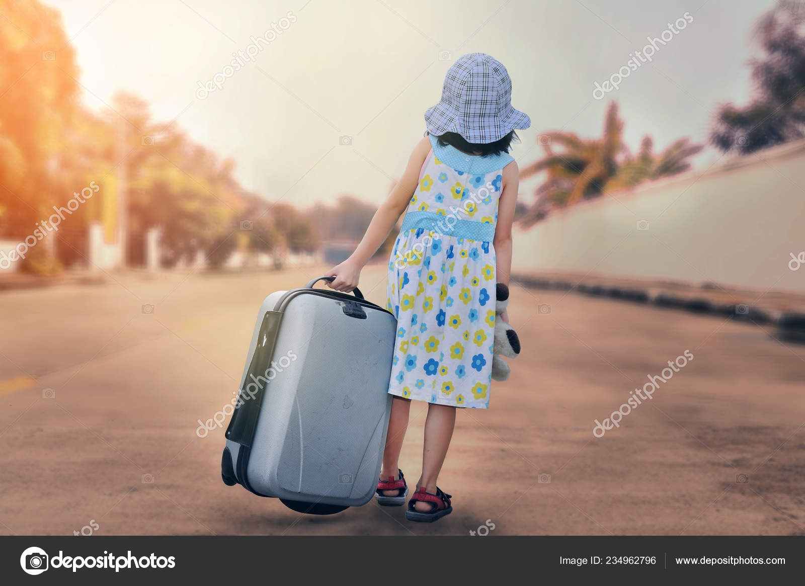 little girl with suitcase
