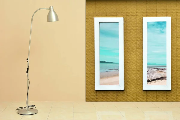 Modern floor lamp against light beige wall with window frame reveal  sea view landscapes. Vacation concept.