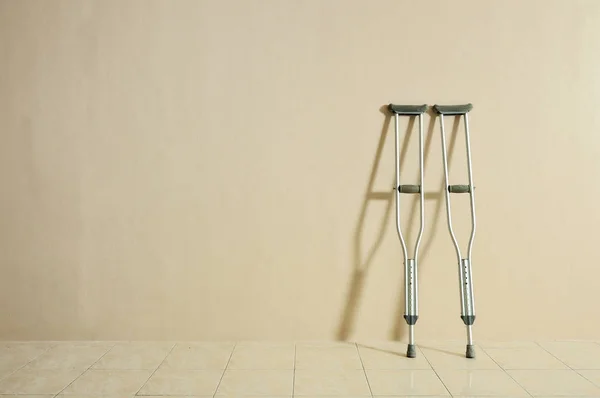 Crutches Wall Shadow Copy Space Royalty Free Stock Photos