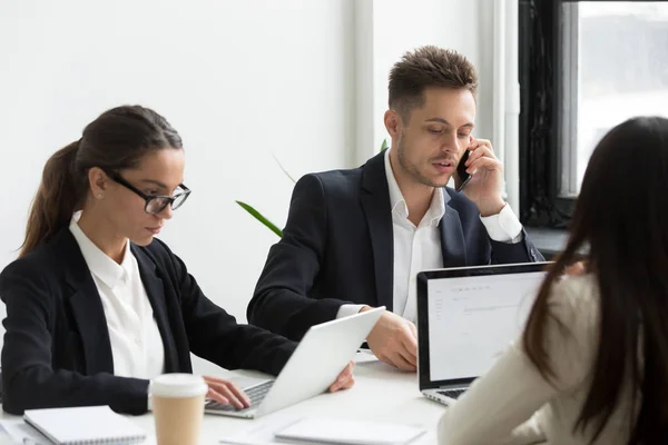 Executive business people using laptops for work, talking on pho — Stock Photo, Image