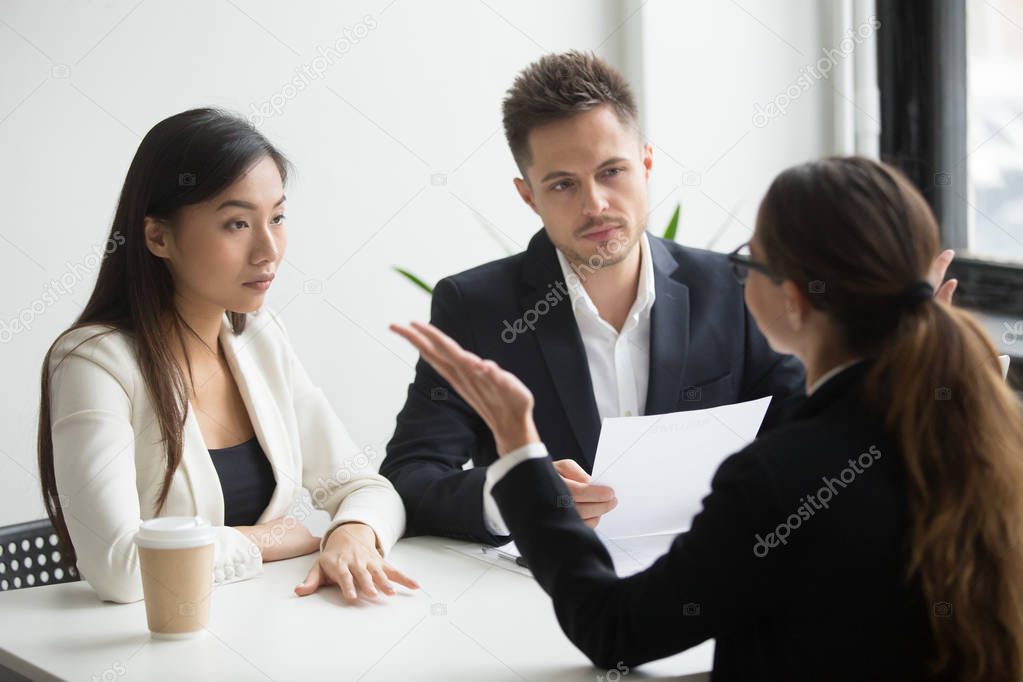 Skeptical diverse hr managers interviewing female applicant, bad