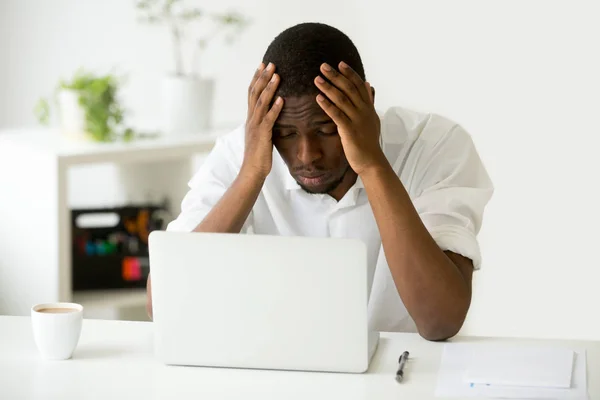 Depressed African American worker upset with company crisis — Stock Photo, Image