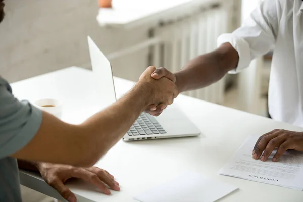 Close up of work employer shaking hand of job applicant — Stock Photo, Image