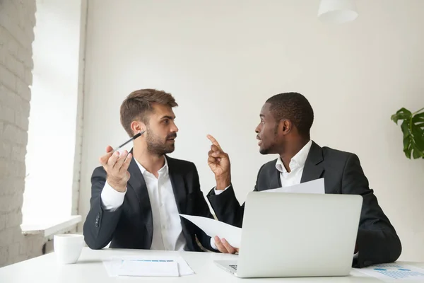 Mad African American arguing with Caucasian colleague about docu — Stock Photo, Image