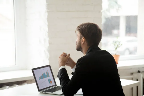 Dreamy businessman thinking about future business projects — Stock Photo, Image