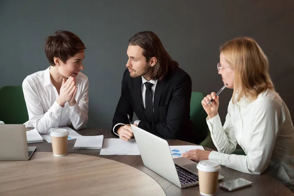 Business partners negotiating about project during meeting in bo — Stock Photo, Image
