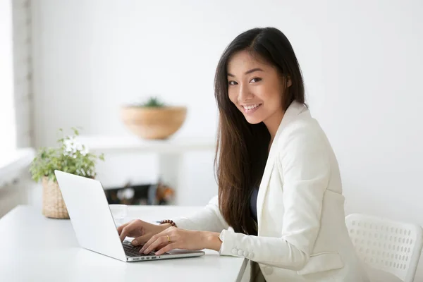 Portrait of female Asian professional posing smiling at camera — Stock Photo, Image