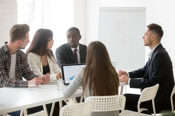 Focused colleagues cooperating talking about strategies and plan — Stock Photo, Image