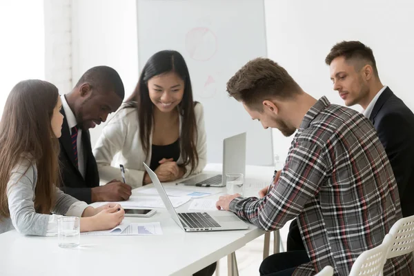 Diverse partners signing agreement after successful negotiations — Stock Photo, Image