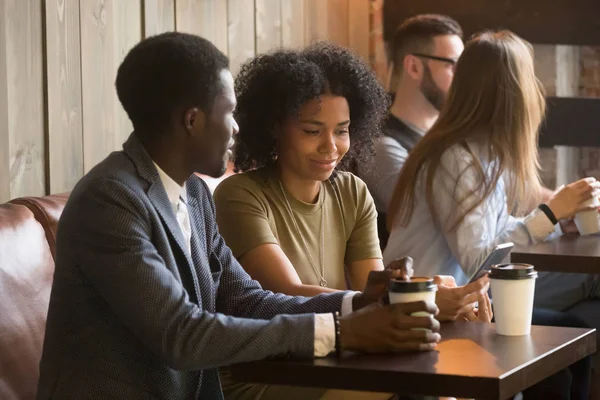 Multiracial people enjoying coffee to go during break in cafe — Stock Photo, Image