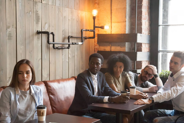 Upset rejected girl ignoring people cheering her in cafe