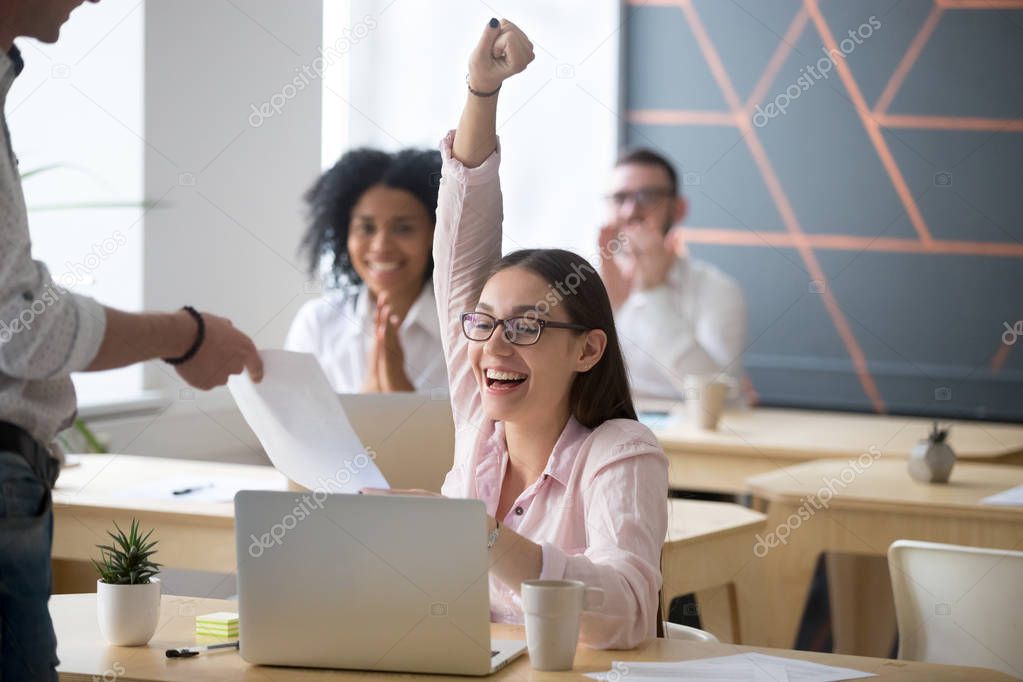 Excited female worker happy receiving promotion letter