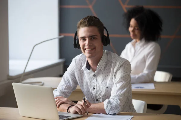 Smiling male worker in headset posing for picture — Stock Photo, Image