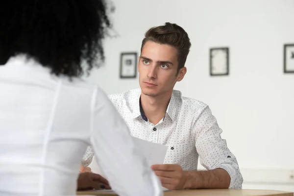 Serious male employee listening to colleague arguments on financ — Stock Photo, Image