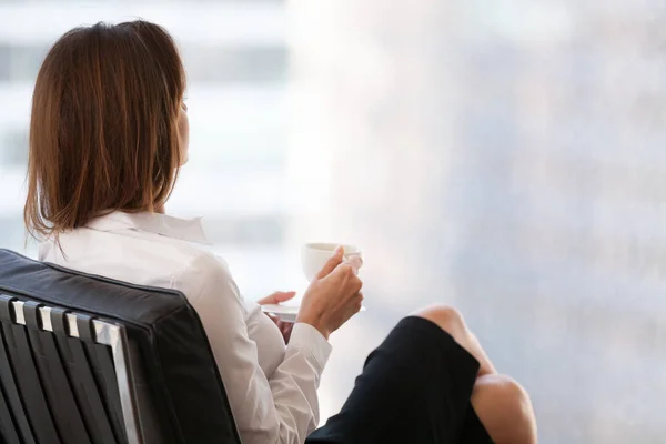 Confident female enjoying coffee thinking about success — Stock Photo, Image