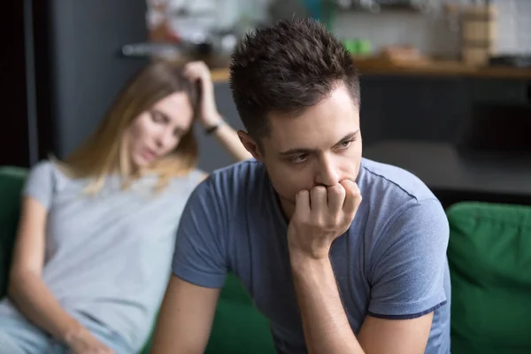 Upset boyfriend thinking of family conflicts after fight with gi — Stock Photo, Image