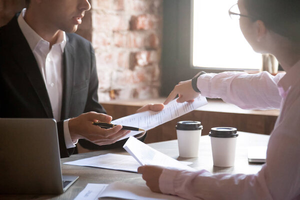 Man and woman working with documents at office