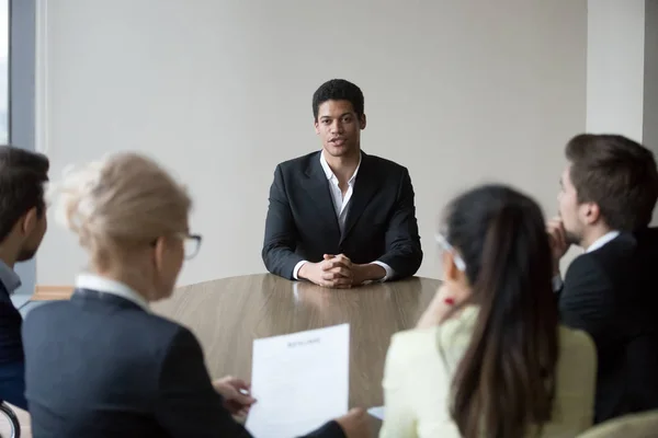Group of employees interviewing new african worker at office boa — Stock Photo, Image