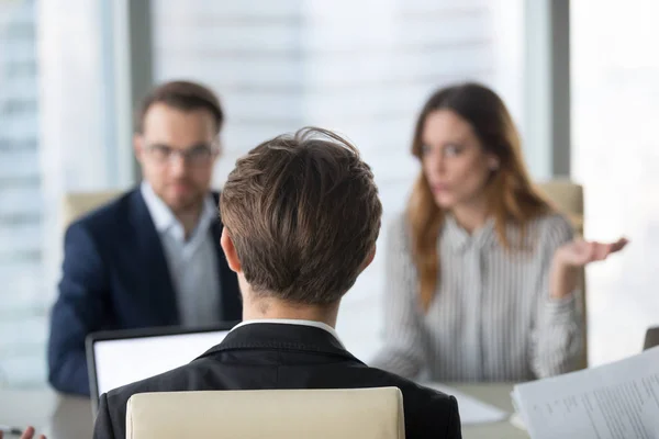 Back view of male CEO negotiating with diverse partners — Stock Photo, Image