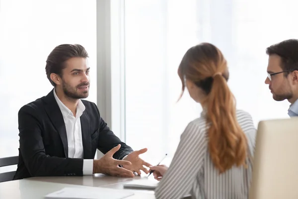 Confident male applicant talk at job interview — Stock Photo, Image