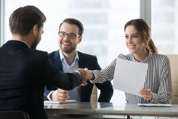 Smiling employers handshaking male candidate congratulating with — Stock Photo, Image