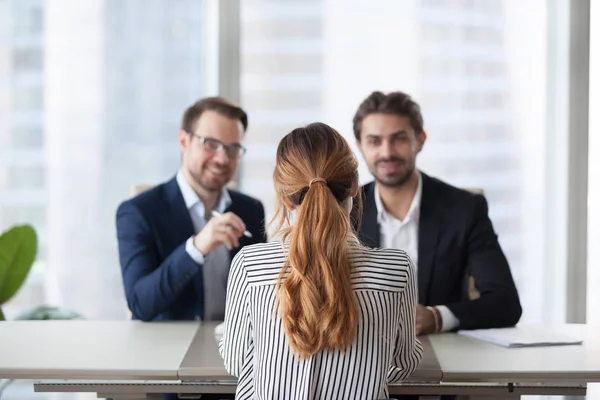 Back view of female job applicant interview in office — Stock Photo, Image