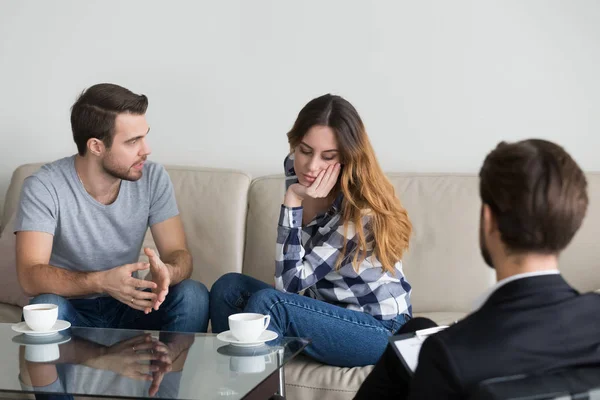 Young couple discuss relationships problems at counselor — Stock Photo, Image