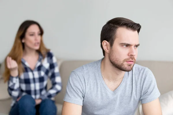 Annoyed husband tired of wife lecturing and arguing — Stock Photo, Image