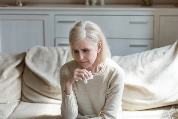 Sad lonely middle aged woman crying holding handkerchief, grievi — Stock Photo, Image