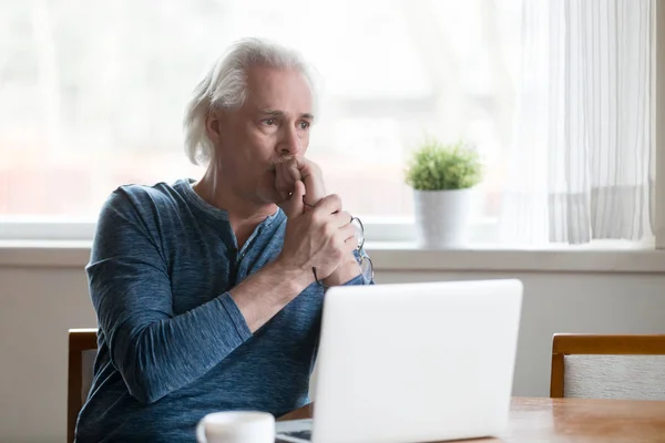 Serious thoughtful senior man looking away thinking of problem s — Stock Photo, Image