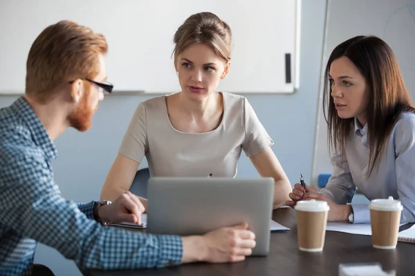 Serious focused business team discussing work results together i — Stock Photo, Image