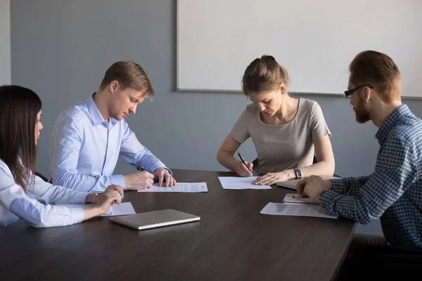 Businessman and businesswoman signing contracts making deal at g — Stock Photo, Image