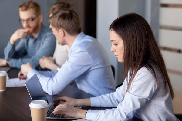 Serious focused businesswoman working typing on laptop in office — Stock Photo, Image