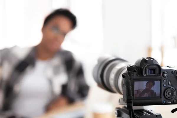 Young black female blogger on camera screen — Stock Photo, Image