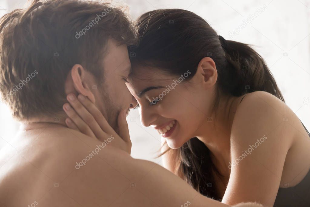 Young attractive happy couple in love kissing