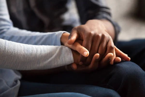 Close up black male and female holds hands — Stock Photo, Image