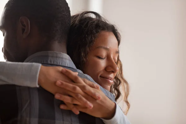 Close up black African wife embracing husband — Stock Photo, Image