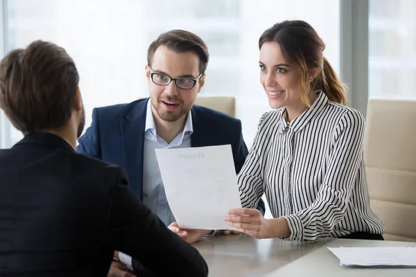 Two hr managers smiling and looking at applicant. — Stock Photo, Image