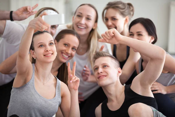 Sportive athletic millennial people making selfie indoors — Stock Photo, Image