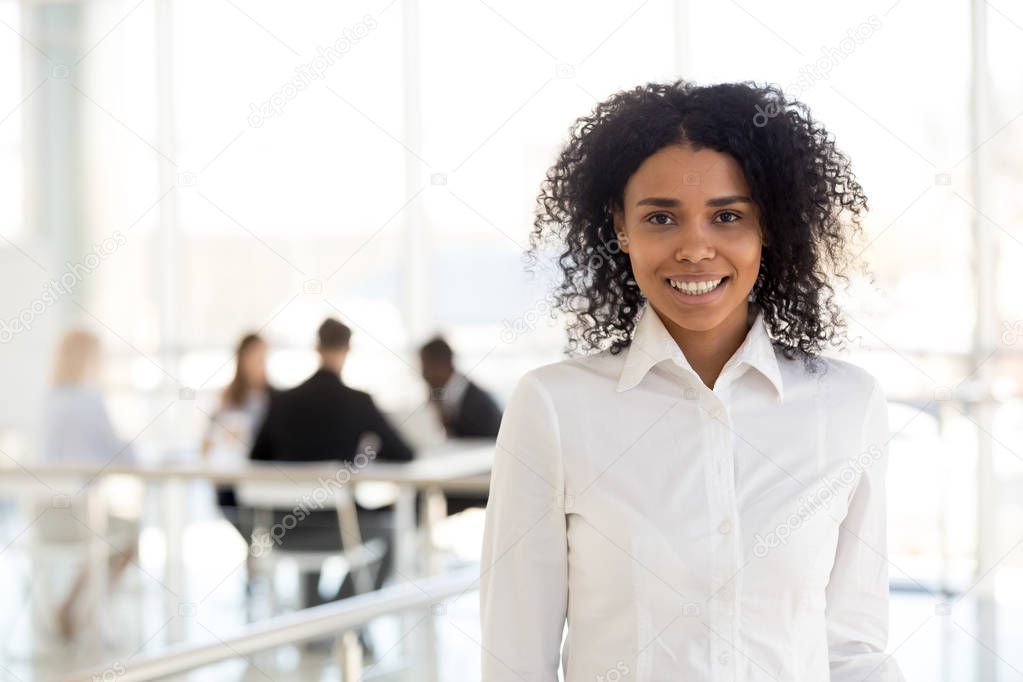 Portrait of smiling black female employee posing for picture