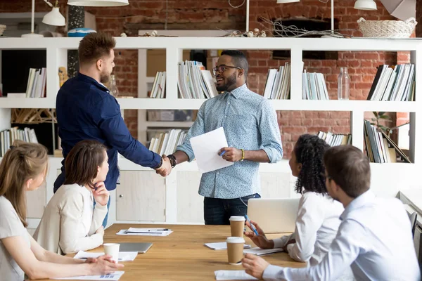 Team leader handshake make employee greeting with success