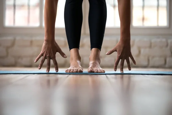 Sporty yogi woman practicing yoga, doing bend exercise, standing — Stock Photo, Image